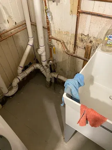 Basement Utility Drain Service — Drain Master NJ Basement utility sink and drain piping serviced by Drain Master NJ at a New Jersey home