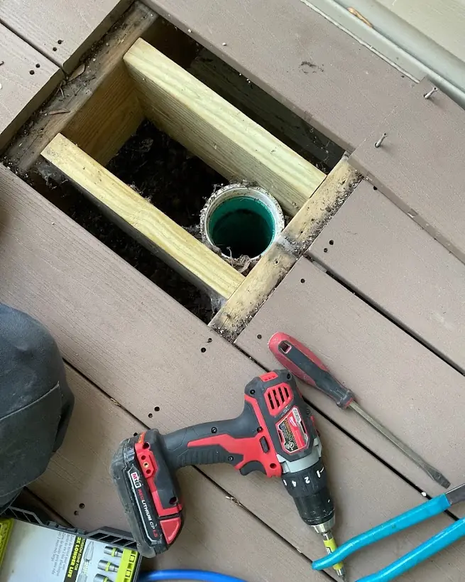 Precision Access to a Hidden Line — Drain Master NJ Deck boards lifted to access a hidden drain line located beneath at a New Jersey home