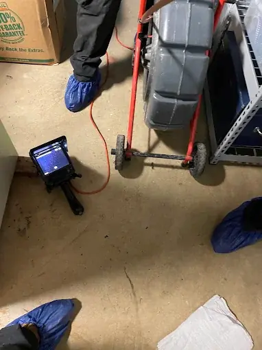 Sewer camera inspection reel and monitor set up inside a New Jersey home — the same rig we bring to Hampton inspections