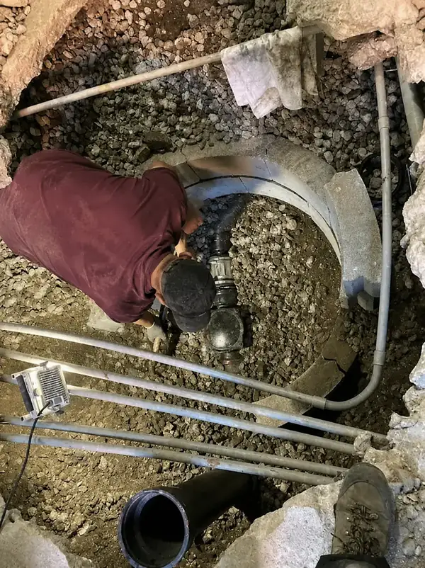 Sewer Cleanout Installed for Easy Access — Drain Master NJ Drain Master NJ technician installing a new sewer cleanout tee in a hand-dug trench at a New Jersey home