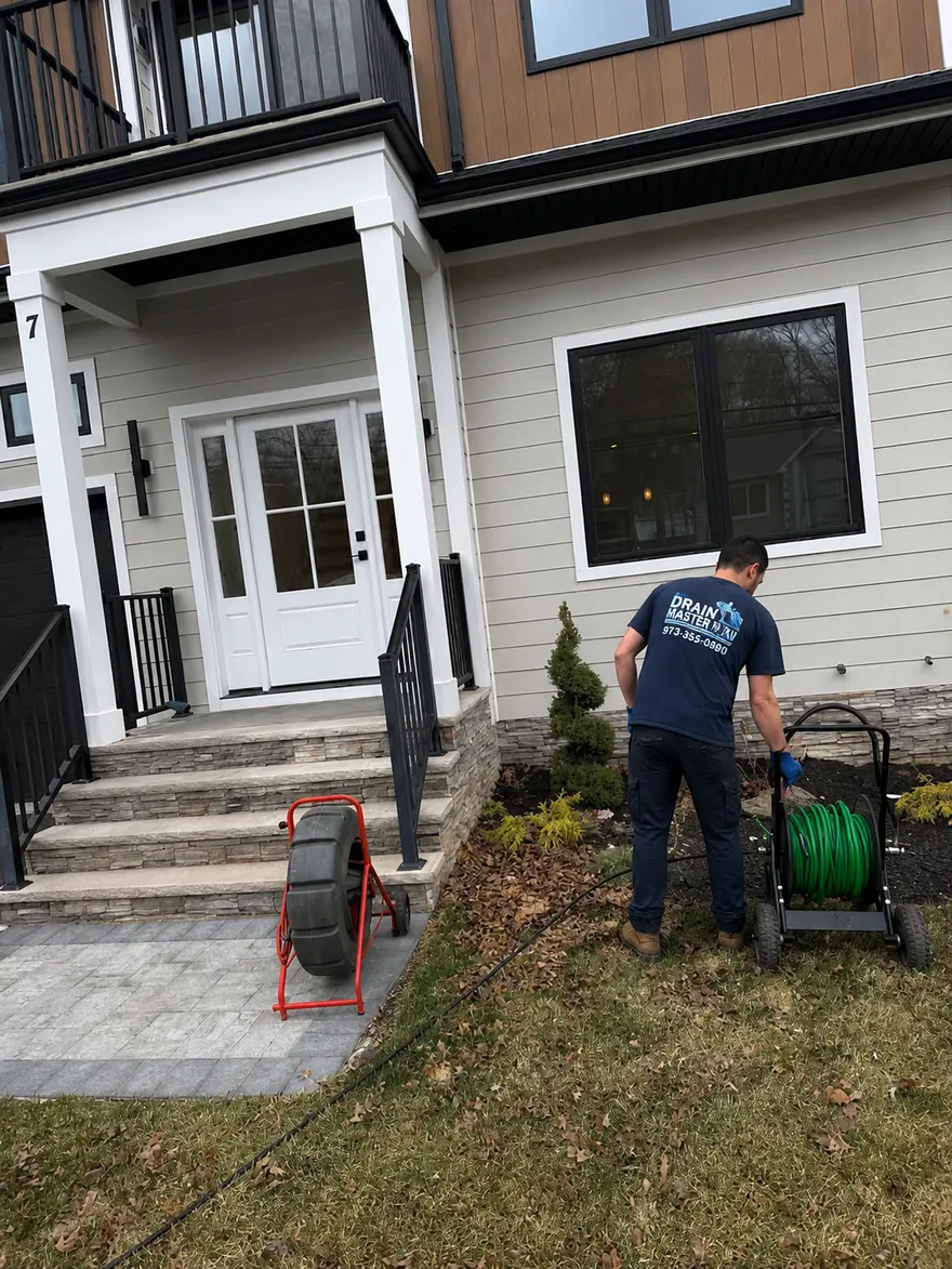 Drain & Sewer Leak Detection in New Jersey — Drain Master NJ Drain Master NJ technician using sewer camera equipment to locate a hidden drain leak at a New Jersey home